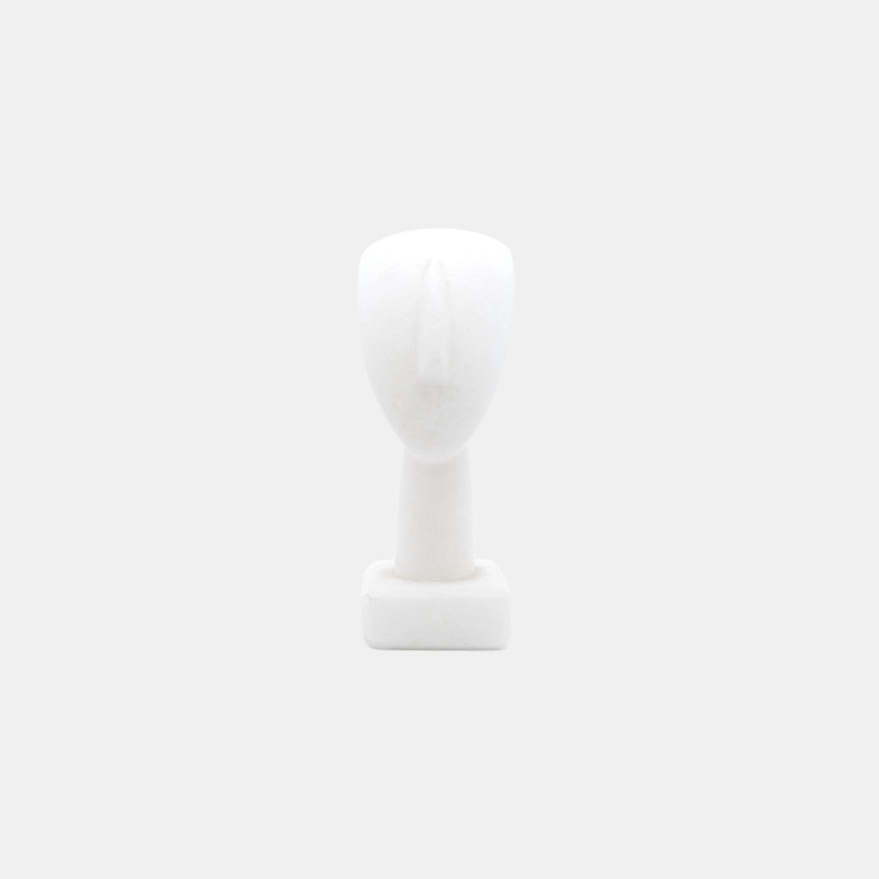 Head of a Figurine, Triangle Spedos, Naxos Marble, Cycladic Art - Minimalist white marble sculpture of a human head with triangular shaped face originating from Naxos, Greece, exemplifying ancient Cycladic art style.