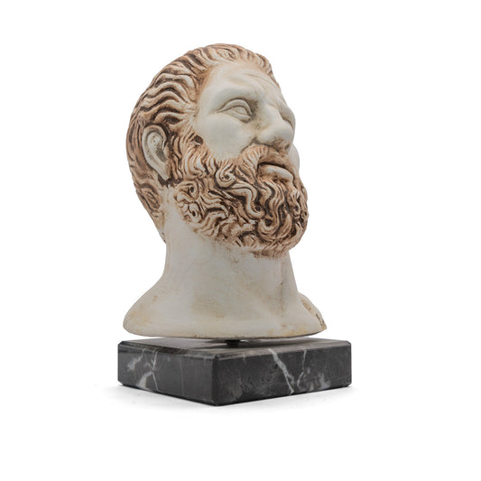 Plaster statuette of Hippocrates, the ancient Greek Father of Medicine, on a marble pedestal. Figurine decor inspired by ancient Greek history and culture.