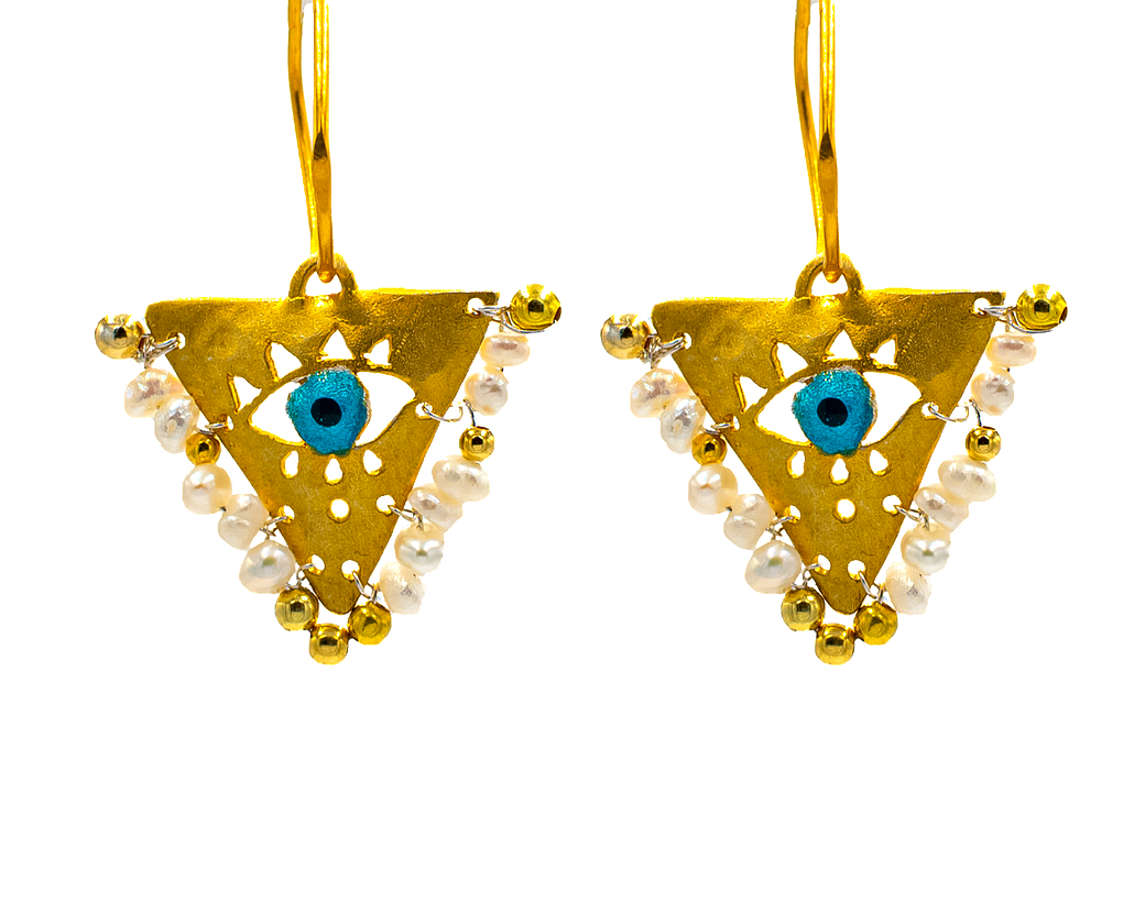 Gold-plated silver earrings with Pearl White beads and blue evil eye charm. Handcrafted jewelry inspired by the Filakto, a traditional triangular lucky charm.