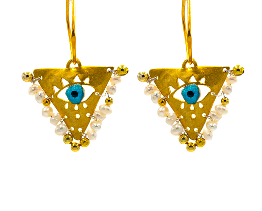 Gold-plated silver earrings with Pearl White beads and blue evil eye charm. Handcrafted jewelry inspired by the Filakto, a traditional triangular lucky charm.