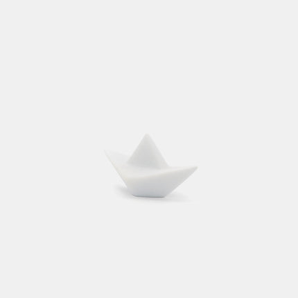 Close up of handmade origami paper boat sculpture