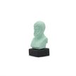 Close up of aristotle coloured figurine in muted mint green