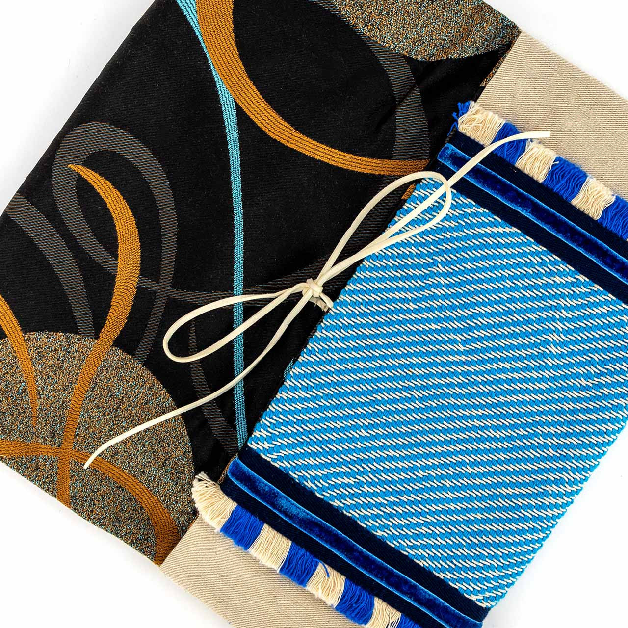 Close up of beige and cycladic blue tassels pouch handcrafted envelope