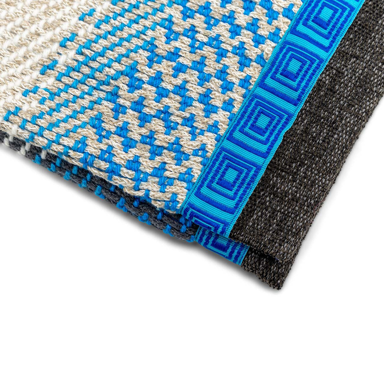 Close up of gray and blue meander envelope