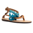 Close up of boho, sea shell in light blue , handmade leather sandals