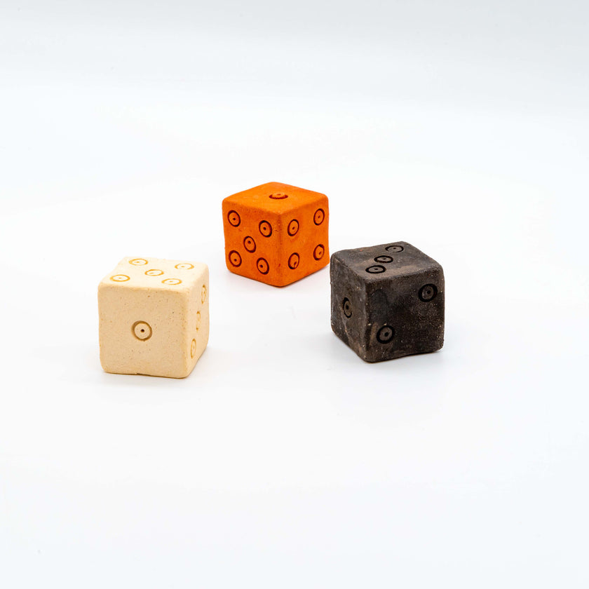 Close up of set of 3 dice, ancient toy