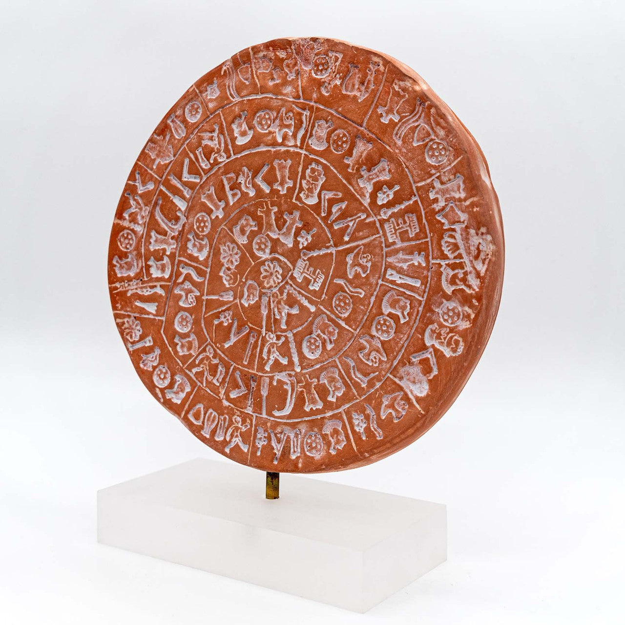 Close up of phaistos disc on a stand, handcrafted art