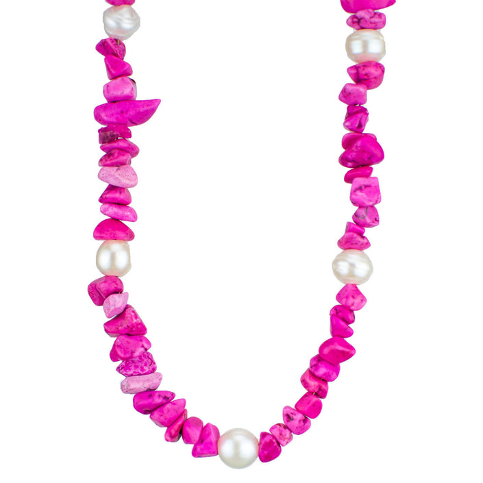 Lightweight, summery pendant made from natural painted coral and freshwater pearls. The fresh pink colour reminds us of summer and adds a fun splash to any wardrobe.