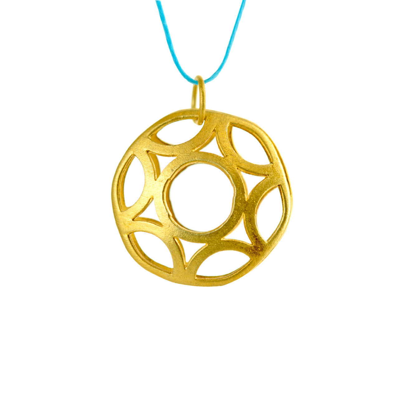 Close up of handcrafted gold-plated silver geometric circle pendant necklace