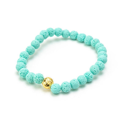 Close up of turquoise lava & gold buddha bracelet