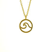 Close up of gold sea wave necklace
