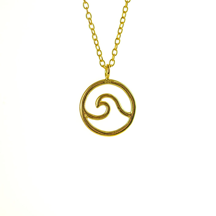 Close up of gold sea wave necklace