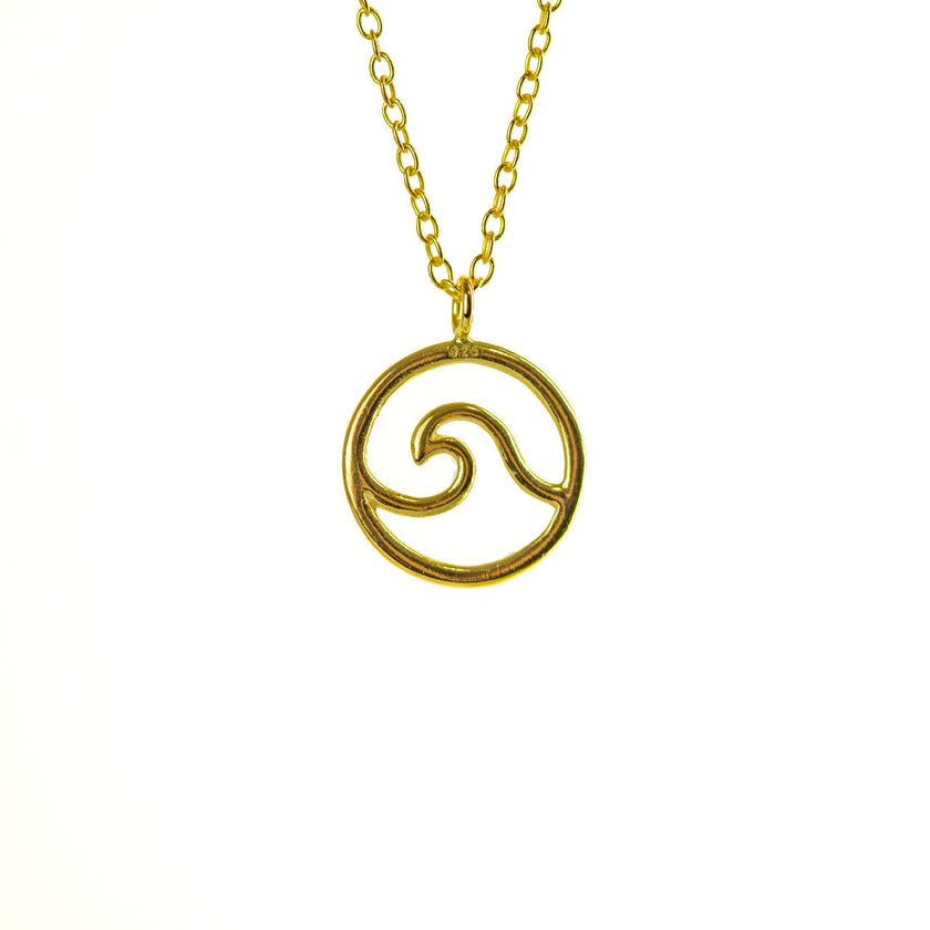 Close up of gold sea wave necklace