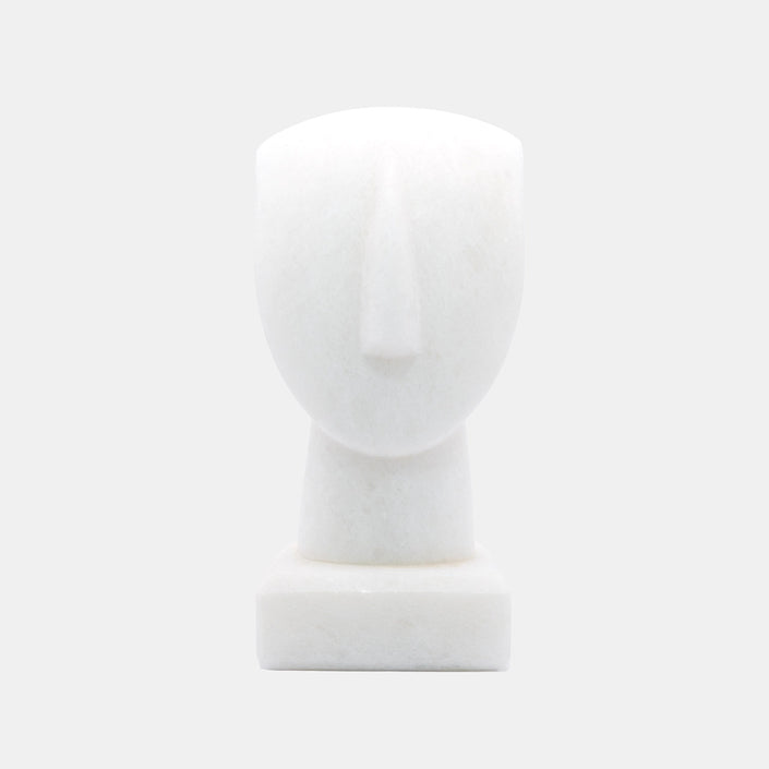 The image shows a simplified representation of a human head and neck on a base, likely a mannequin or a sculptural form. I...