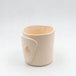 Close up of cycladian style, short ceramic mug in ivory