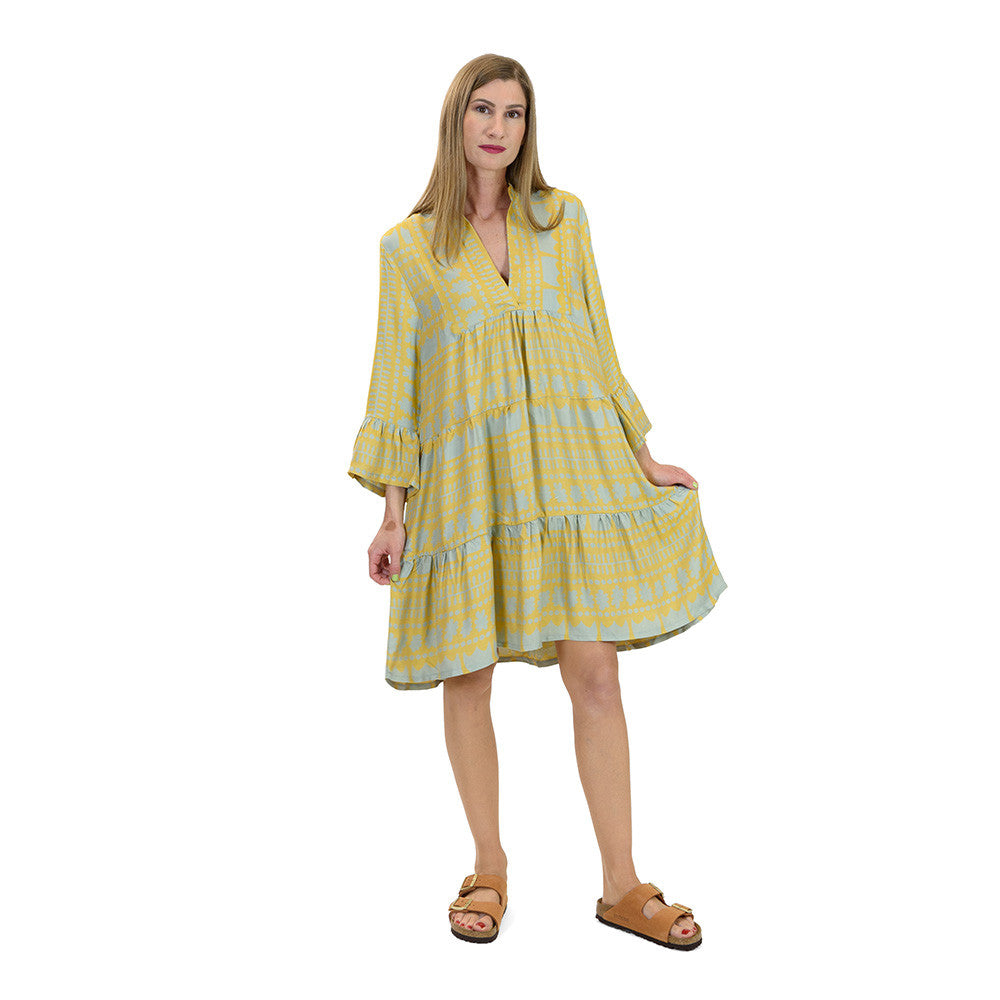 Close up of kaftan dress in champagne yellow & teal