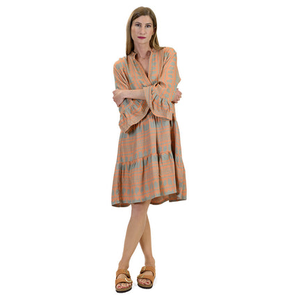 Close up of kaftan dress in tangerine & olive khaki