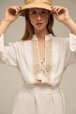 Close up of ione kaftan, linen dress in white