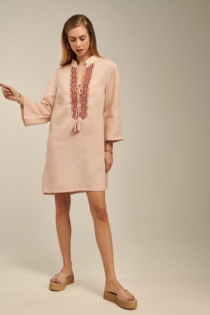 Close up of ione kaftan, linen dress in champagne pink