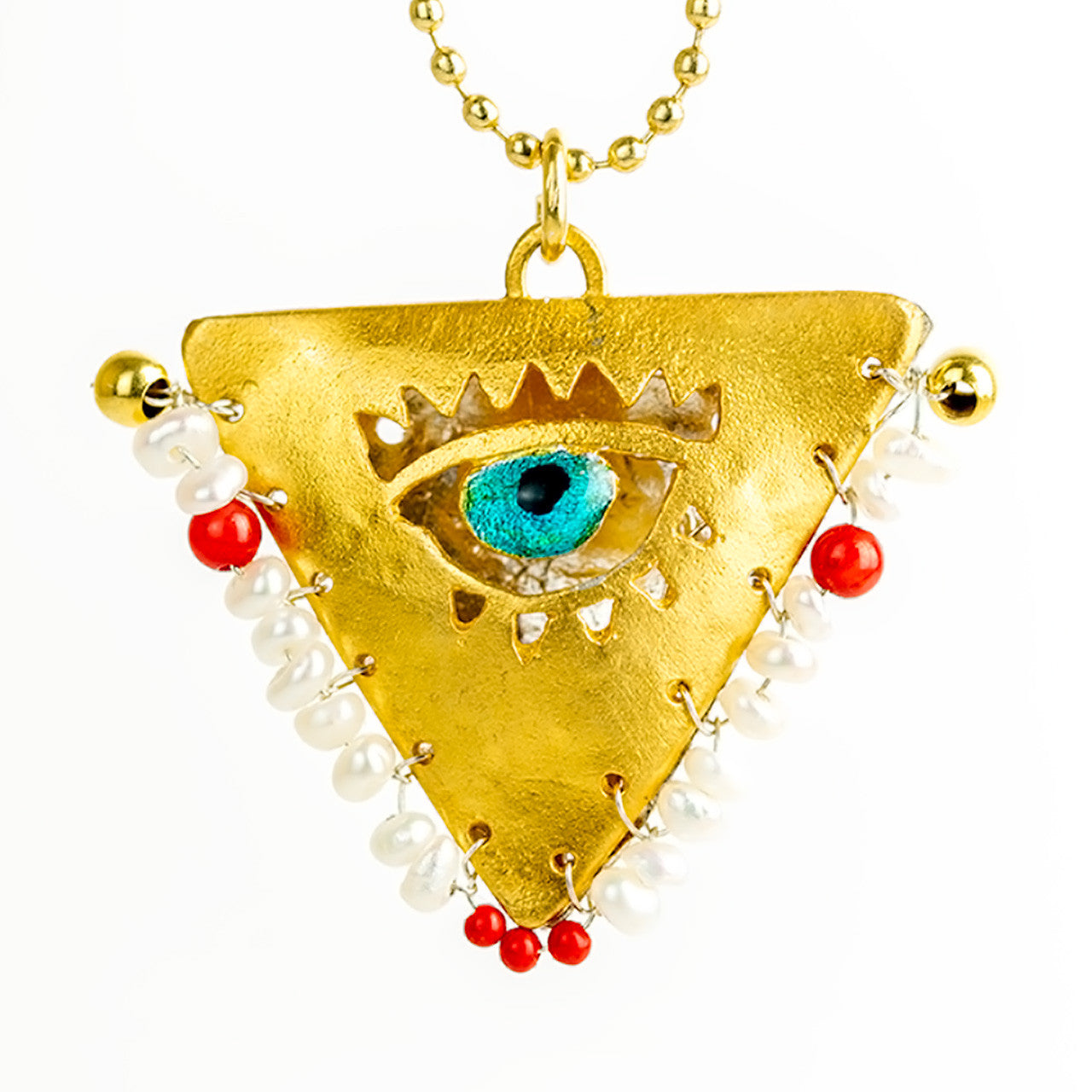 Gold-plated silver earrings and evil eye necklace with pearls and red beads handcrafted by Filakto. Traditional triangular pillow charm stitched by grandmother for good luck and protection of newborn baby. Unique modern jewelry inspired by a centuries-old Greek family ritual.