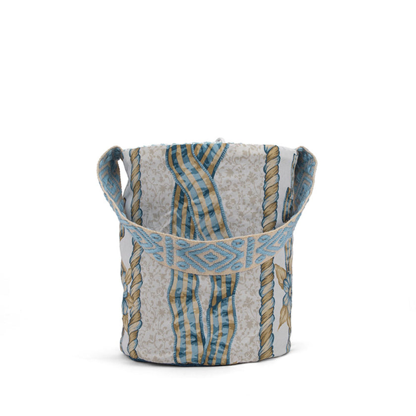 Close up of shades of blue and brown handwoven bucket bag