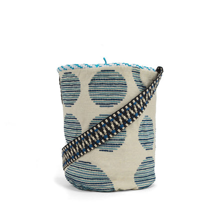 Close up of light blue and fluo yellow handwoven bucket bag