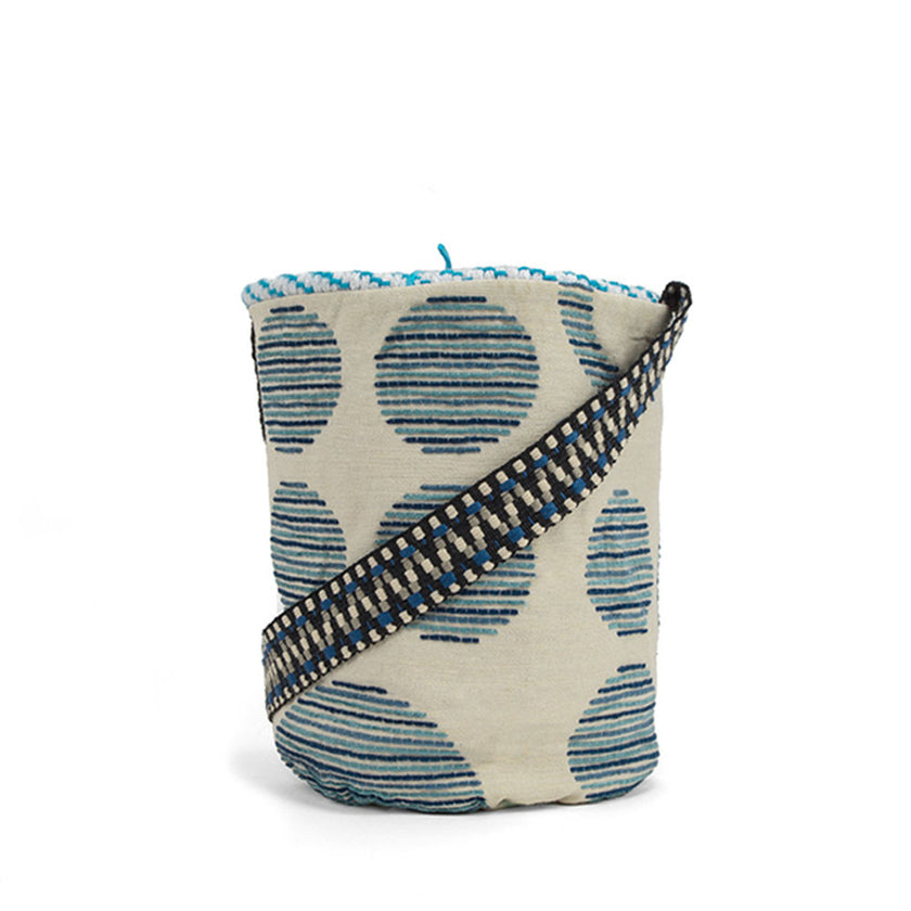 Close up of light blue and fluo yellow handwoven bucket bag