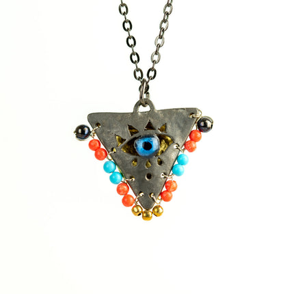 Close up of limited: coral red and baby blue on black, 