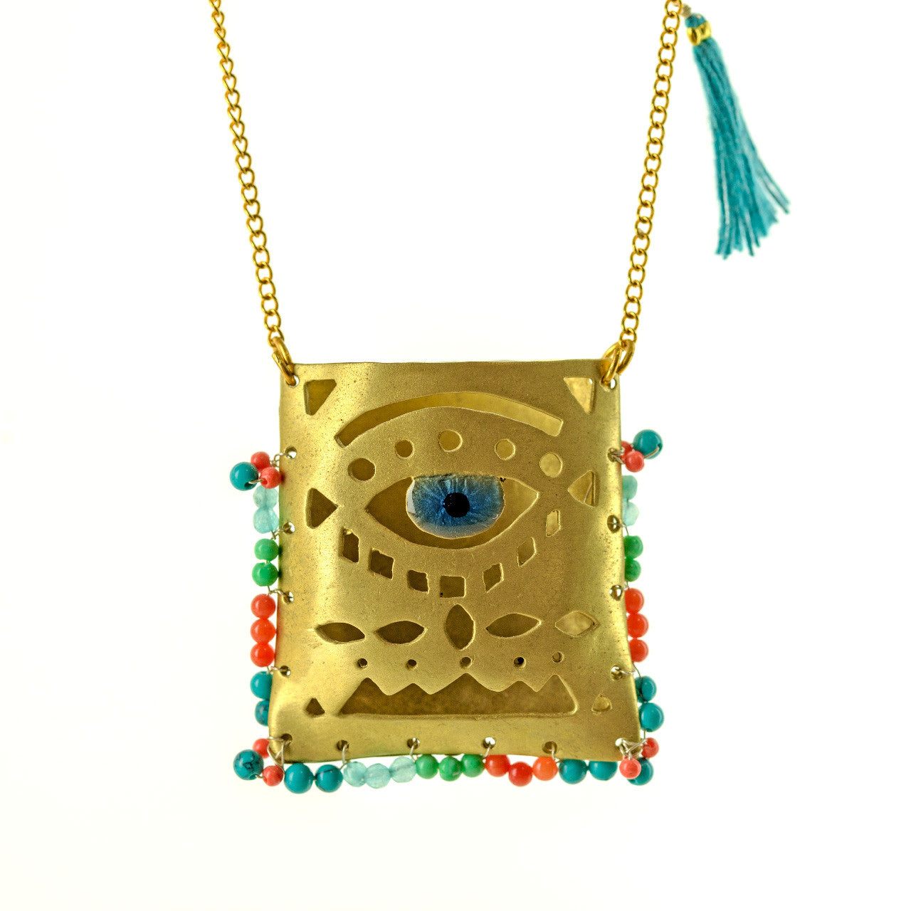 Close up of evil eye tagári, in viridian green, petrol blue and coral red, pendant