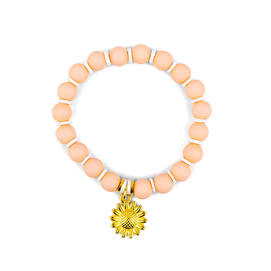 Close up of peachy sunflower summer bracelet in baby pink