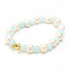 Close up of pearls, baby blue beads & gold dolphin bracelet