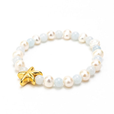 Close up of pearls and baby blue & gold star bracelet