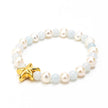 Close up of pearls and baby blue & gold star bracelet