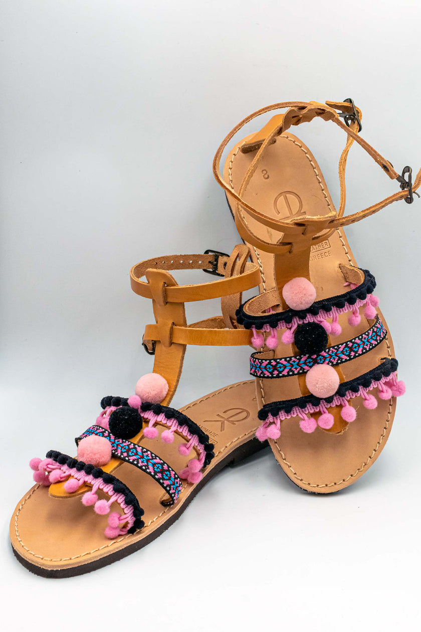 Close up of gladiator in pink, handmade leather sandals