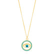 The image shows a gold-colored necklace with a pendant that features the design of an eye. The eye is centered within a circular frame, and the frame is embellished with what appears to be turquoise-colored stones or crystals. The eye itself has a blue iris, which stands out against the gold and turquoise colors. This type of design is often associated with the 