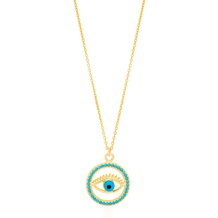The image shows a gold-colored necklace with a pendant that features the design of an eye. The eye is centered within a ci...