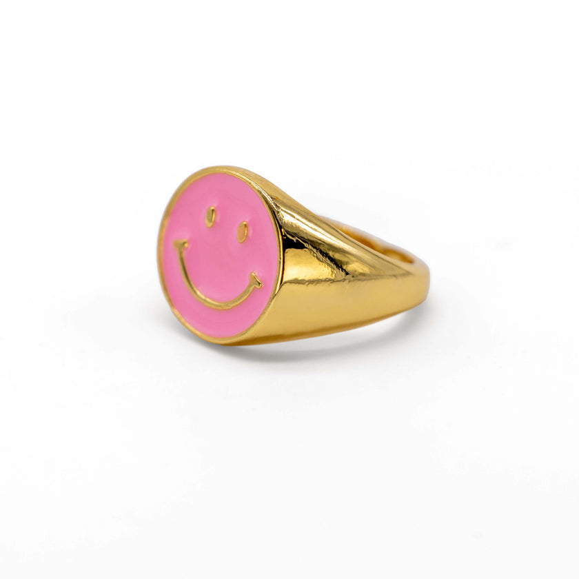 Close up of bubblegum pink smiley ring