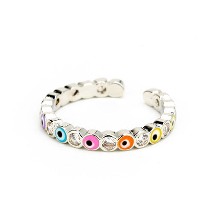 Close up of sparkly multicoloured evil eye ring in silver