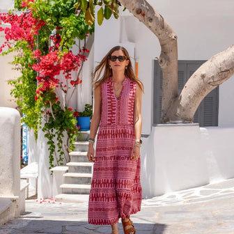 Woman wearing a summer dress walking near Tereza’s Greek Concept Store in Naxos Old Town Greece
