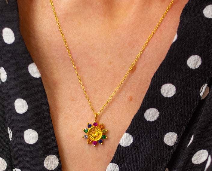 Close up of tereza's zircon flower pendant