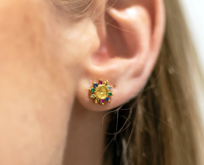Close up of tereza’s zircon flower stud earrings
