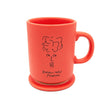 Close up of meet marika ceramic coffee mug & coaster in terracotta