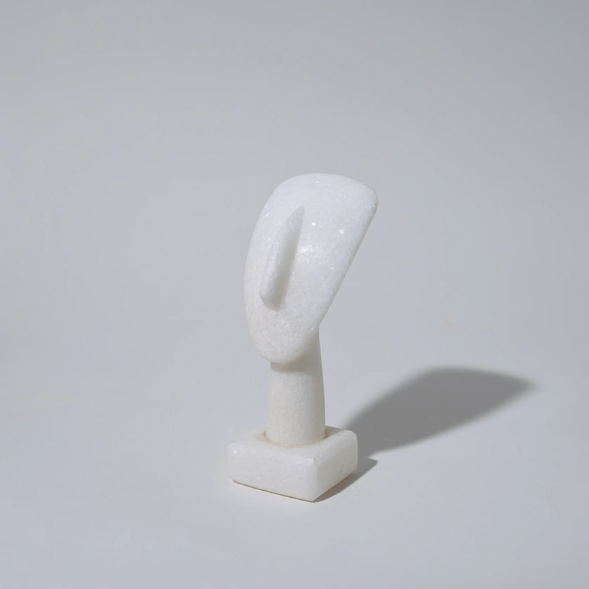 Close up of small cycladic marble head sculpture 11cm