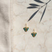Medium Aegean mint fylachto earring on marble surface with handpainted eye and mint bead details