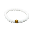 Shop the Almyra Organic Bracelet, handmade by Tereza in Naxos. Featuring matte white beads and a natural wood accent. The ...