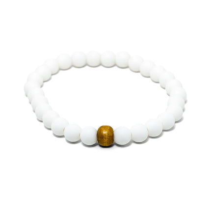 Shop the Almyra Organic Bracelet, handmade by Tereza in Naxos. Featuring matte white beads and a natural wood accent. The ...