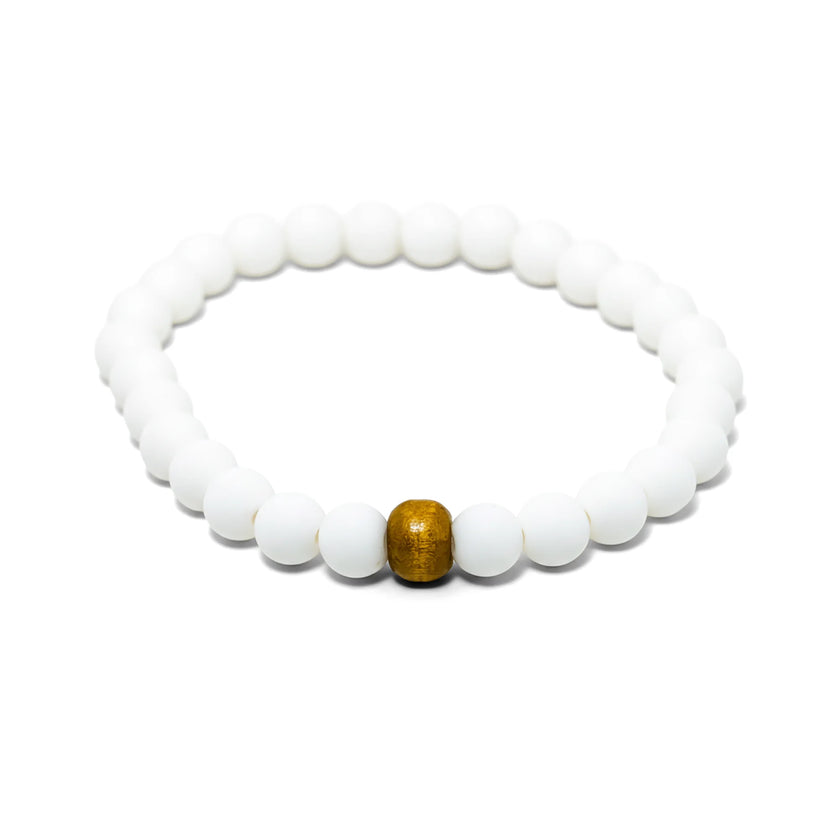 Shop the Almyra Organic Bracelet, handmade by Tereza in Naxos. Featuring matte white beads and a natural wood accent. The ...
