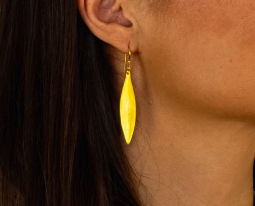 Close up of handcrafted greek olive leaf earrings
