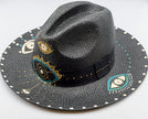 Close up of glam eye, fedora, hand-painted hat in black