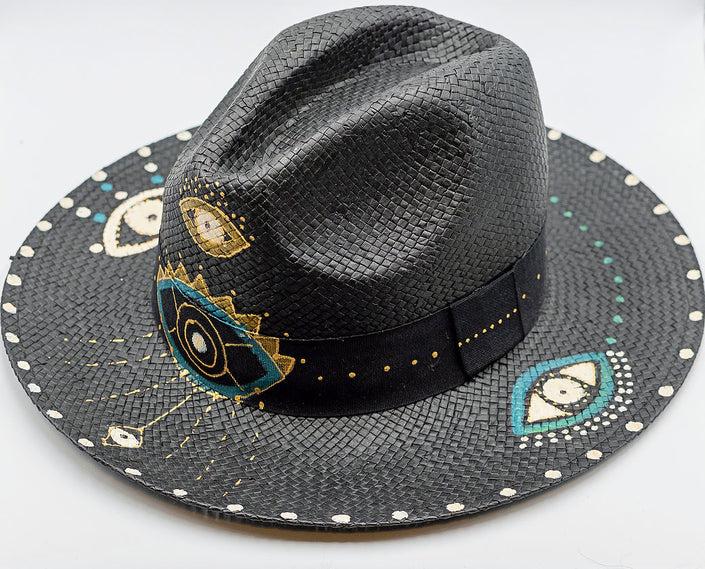 Close up of glam eye, fedora, hand-painted hat in black